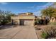 Two-story house with two car garage and desert landscaping at 12026 N 138Th St, Scottsdale, AZ 85259