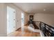 Light and airy hallway with hardwood floors and access to bedrooms at 12026 N 138Th St, Scottsdale, AZ 85259