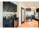 Modern kitchen with dark cabinets, wine cooler and breakfast bar at 12026 N 138Th St, Scottsdale, AZ 85259