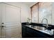 Clean laundry room, featuring a sink, modern washer and dryer, and ample storage at 12026 N 138Th St, Scottsdale, AZ 85259