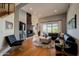 Living room with sectional sofa, hardwood floors, fireplace, and sliding glass doors at 12026 N 138Th St, Scottsdale, AZ 85259