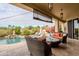 Covered patio overlooking a beautiful pool and mountain views at 12026 N 138Th St, Scottsdale, AZ 85259