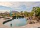 Inviting pool with spa and a stunning mountain backdrop at 12026 N 138Th St, Scottsdale, AZ 85259