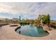 Serene pool area with a waterfall feature at 12026 N 138Th St, Scottsdale, AZ 85259