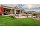 Inviting pool and spa with artificial turf and mountain backdrop at 12026 N 138Th St, Scottsdale, AZ 85259