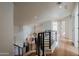 Bright upper hallway with modern metal railing and wood flooring at 12026 N 138Th St, Scottsdale, AZ 85259