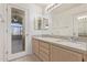 Double vanity bathroom with granite countertops and updated fixtures at 1220 W Gail Ct, Chandler, AZ 85224