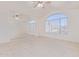 Bedroom with vaulted ceiling, mirrored wall, and large window at 1220 W Gail Ct, Chandler, AZ 85224