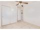 Spacious bedroom with double door closet and tile floors at 1220 W Gail Ct, Chandler, AZ 85224