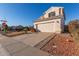 Two-story house with a two-car garage and a landscaped yard at 1220 W Gail Ct, Chandler, AZ 85224