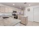 Bright kitchen with granite countertops, ample cabinetry, and an island at 1220 W Gail Ct, Chandler, AZ 85224