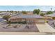 Ranch-style home with solar panels and landscaped yard at 12411 N Cantata Ct, Sun City, AZ 85351