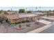 Ranch-style home with solar panels, landscaped yard, and street view at 12411 N Cantata Ct, Sun City, AZ 85351