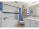 Elegant bathroom with a bathtub and white cabinetry at 12411 N Cantata Ct, Sun City, AZ 85351