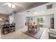 Bright dining area with a wood table and chairs, view to kitchen at 12411 N Cantata Ct, Sun City, AZ 85351