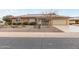 Brick ranch home with solar panels and landscaped yard at 12411 N Cantata Ct, Sun City, AZ 85351