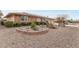 Brick ranch house with desert landscaping, and a gravel driveway at 12411 N Cantata Ct, Sun City, AZ 85351