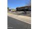 Landscaped front yard with gravel, flowers, and a bench at 12411 N Cantata Ct, Sun City, AZ 85351