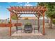 Relaxing pergola with fire pit and seating area at 12411 N Cantata Ct, Sun City, AZ 85351