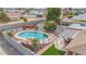 Kidney-shaped pool with patio and surrounding landscaping at 12411 N Cantata Ct, Sun City, AZ 85351