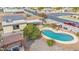 Aerial view of a kidney-shaped pool, patio, and pergola at 12411 N Cantata Ct, Sun City, AZ 85351