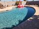 Relaxing in-ground pool, perfect for a refreshing dip with lounge chairs and a fun flamingo float at 12411 N Cantata Ct, Sun City, AZ 85351