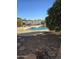 Inviting kidney-shaped pool with surrounding rock landscaping and patio at 12411 N Cantata Ct, Sun City, AZ 85351