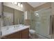 Updated bathroom with walk-in shower and modern vanity at 13129 W Junipero Dr, Sun City West, AZ 85375