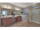 Spa-like bathroom featuring a walk-in shower and a relaxing jetted tub at 13129 W Junipero Dr, Sun City West, AZ 85375