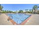 Large community pool with plenty of lounge chairs at 13129 W Junipero Dr, Sun City West, AZ 85375