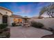 Relaxing courtyard featuring a bistro set and lush greenery at 13129 W Junipero Dr, Sun City West, AZ 85375