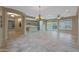 Open-concept dining area with a chandelier and adjacent kitchen at 13129 W Junipero Dr, Sun City West, AZ 85375