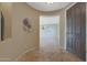 Elegant entryway featuring tile floors and a view into the living area at 13129 W Junipero Dr, Sun City West, AZ 85375