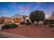 Well-maintained home with a desert landscape and two-car garage at 13129 W Junipero Dr, Sun City West, AZ 85375