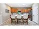 Stylish kitchen with a center island, stainless steel appliances, and counter seating at 13129 W Junipero Dr, Sun City West, AZ 85375