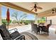 Covered patio with outdoor furniture and view of the well-maintained backyard at 13129 W Junipero Dr, Sun City West, AZ 85375