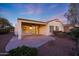 Covered patio with ceiling fan and lighting at 13129 W Junipero Dr, Sun City West, AZ 85375