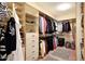 Organized walk-in closet with shelving, drawers, and ample storage space at 13129 W Junipero Dr, Sun City West, AZ 85375