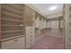 Large walk-in closet with ample shelving and drawer space at 13129 W Junipero Dr, Sun City West, AZ 85375