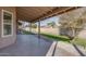 Spacious covered patio, grassy area, and trees at 1354 E Brentrup Dr, Tempe, AZ 85283