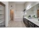 Elegant bathroom featuring double vanity, soaking tub, and separate shower at 1354 E Brentrup Dr, Tempe, AZ 85283