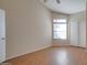 Bright bedroom with wood-look flooring and ceiling fan at 1354 E Brentrup Dr, Tempe, AZ 85283