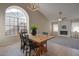 Dining room with large arched window and wood table at 1354 E Brentrup Dr, Tempe, AZ 85283