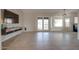 Living room with tile floors, french doors and a mounted TV at 1354 E Brentrup Dr, Tempe, AZ 85283