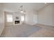 Bright living room with fireplace and carpet flooring at 1354 E Brentrup Dr, Tempe, AZ 85283