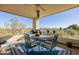 Spacious balcony with mountain views, outdoor dining set, and a ceiling fan at 17022 E Player Ct, Fountain Hills, AZ 85268