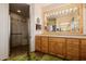 Bathroom with double vanity, large mirror, and a walk-in shower at 17022 E Player Ct, Fountain Hills, AZ 85268