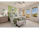 Bright bedroom with a king-size bed, access to balcony, and mountain views at 17022 E Player Ct, Fountain Hills, AZ 85268