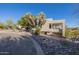 This home features attractive desert landscaping and a unique architectural design at 17022 E Player Ct, Fountain Hills, AZ 85268