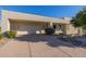 Desert landscape surrounds this modern home with a large garage and covered entry at 17022 E Player Ct, Fountain Hills, AZ 85268